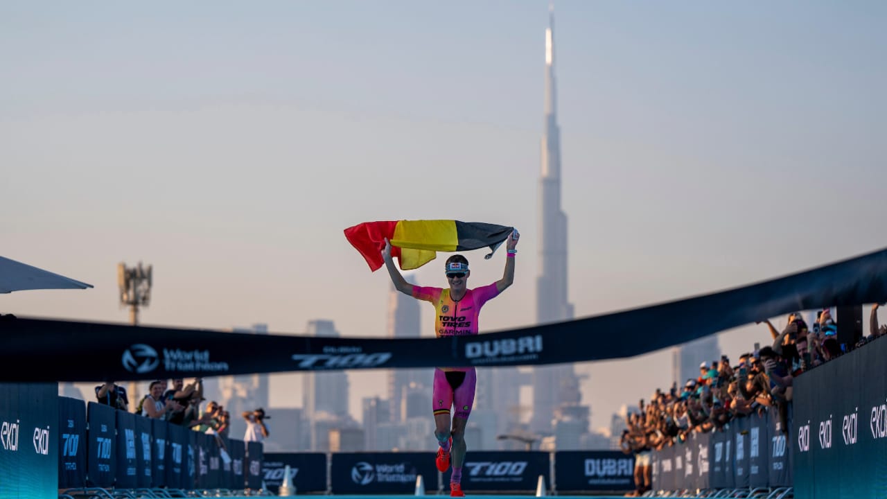 Marten Van Riel of Belgium holds aloft his nation's flag as he wins the T100 World Tour event in Dubai 2024.