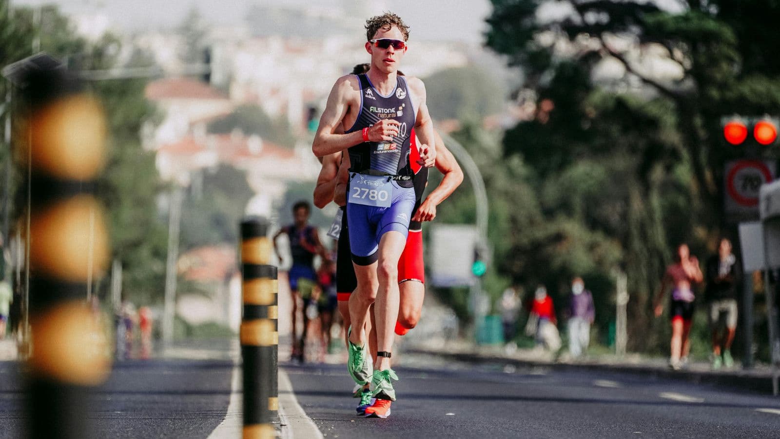 PIC 2 - NUTRITION Triathlete completing a run as part of post-training recovery and muscle repair
