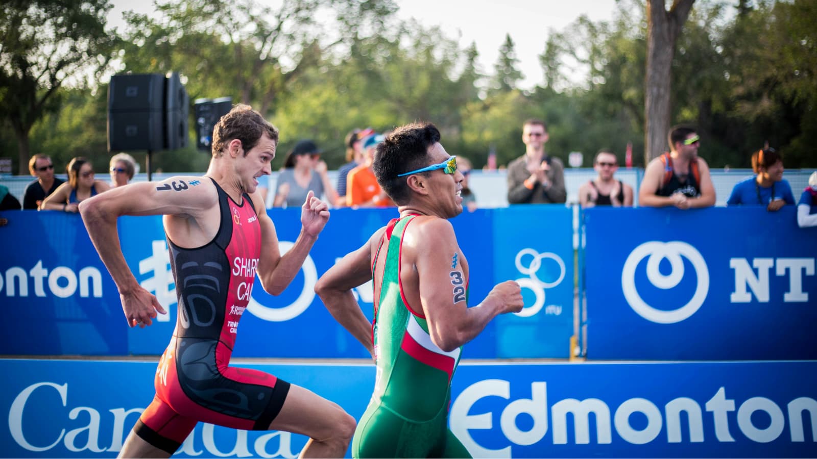 Triathletes training in three disciplines, swimming in open water, cycling on a road bike, and running outdoors as part of a structured triathlon workout plan