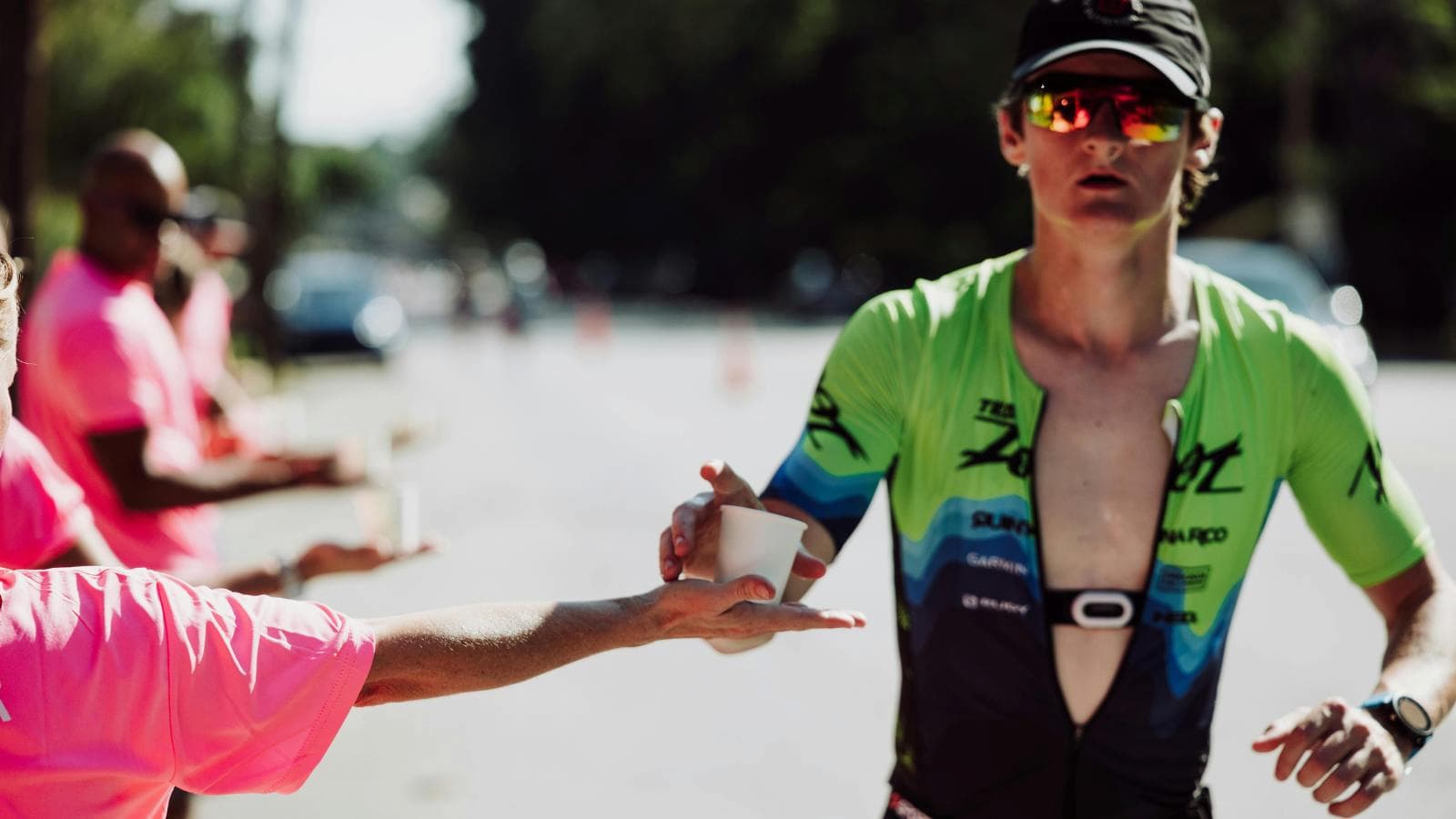 triathlete preparing nutrition plan with carbs hydration and energy gels for ironman triathlon