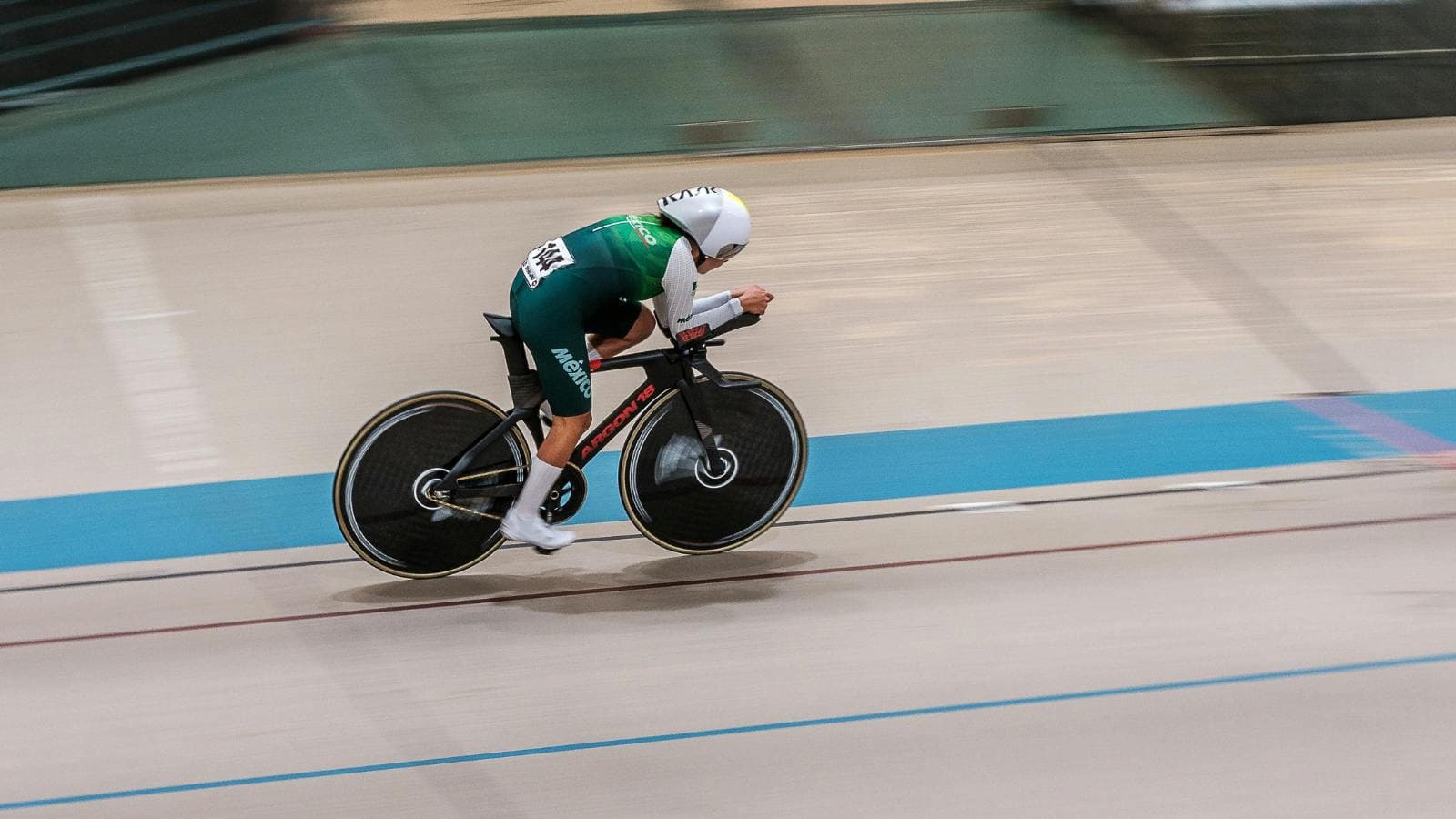 cyclist practicing balance and control on rollers to improve bike handling skills indoors