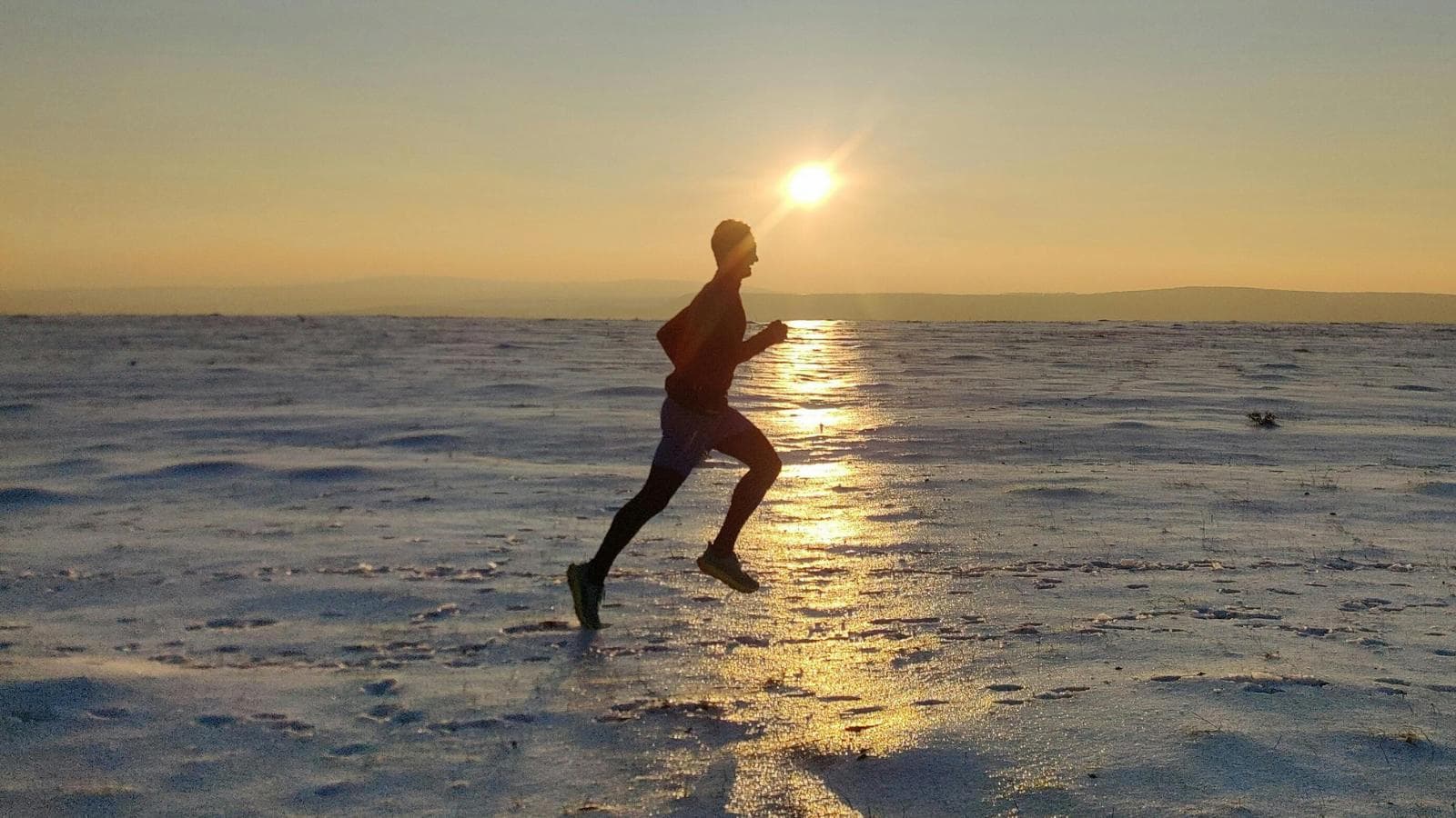 triathlete focusing on recovery with stretching rest and light training during recovery week