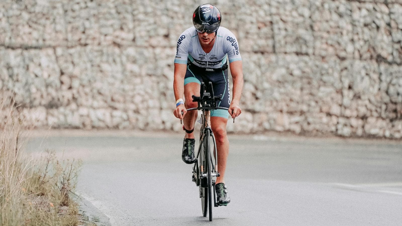 cyclist training at low cadence on road bike to build strength and improve power output