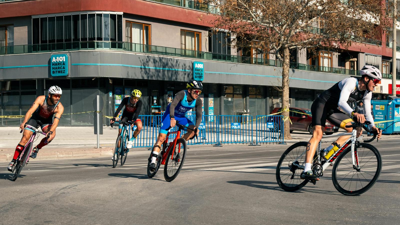first time triathlete competing in swim bike run stages during beginner triathlon event