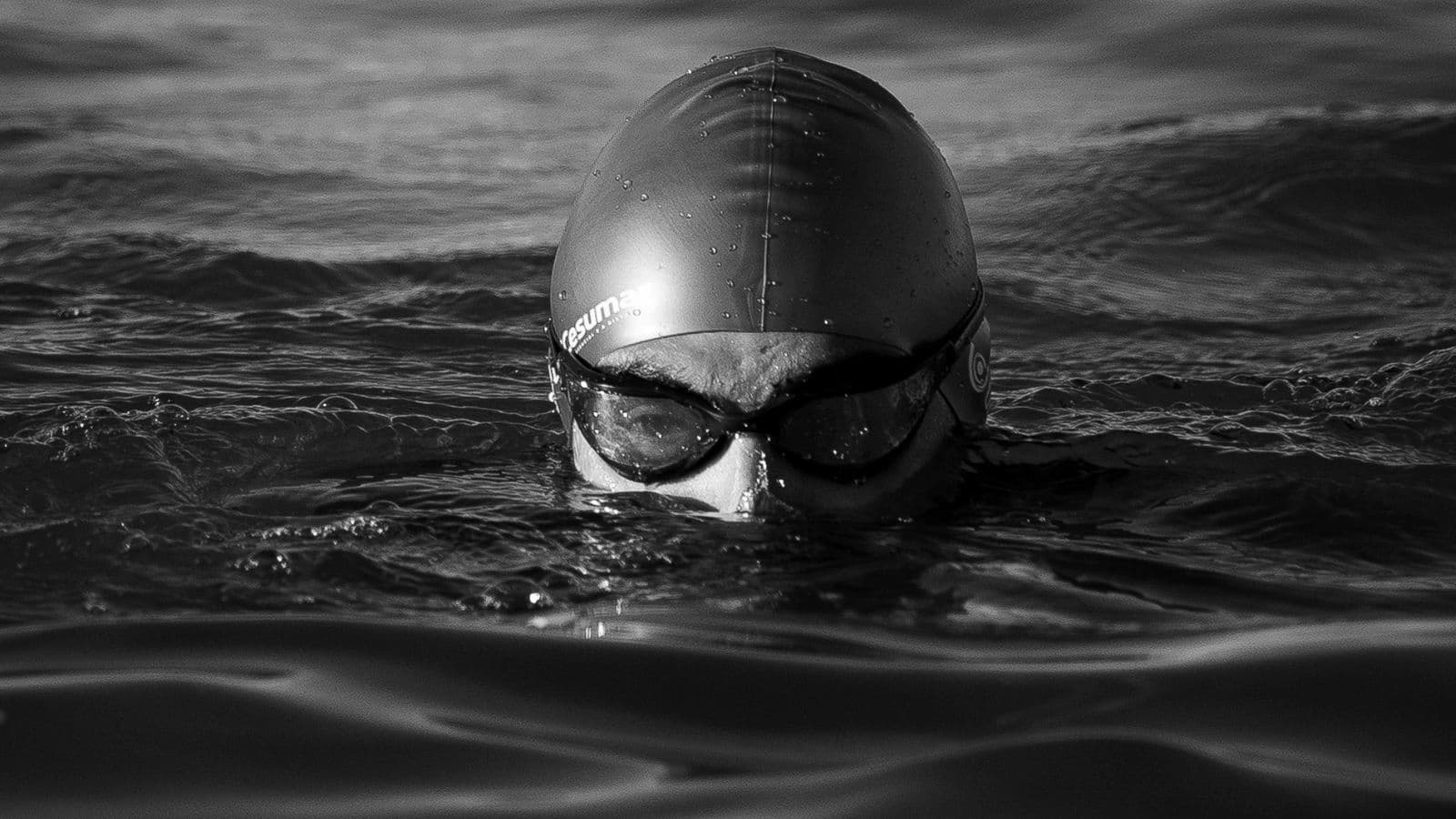 open water triathlete training in cold conditions to improve swimming confidence and adaptability